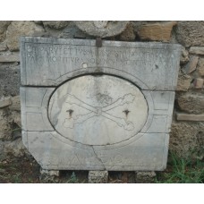 Square marble stone, bone cross in an oblong in square